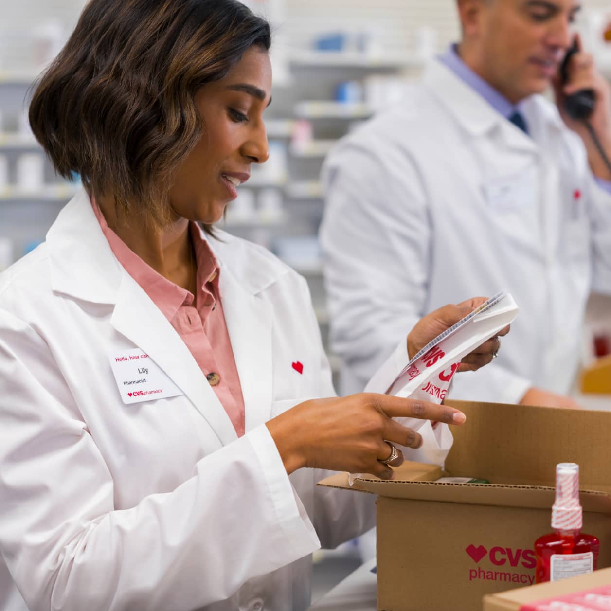 A CVS health care provider in conversation with a patient.
