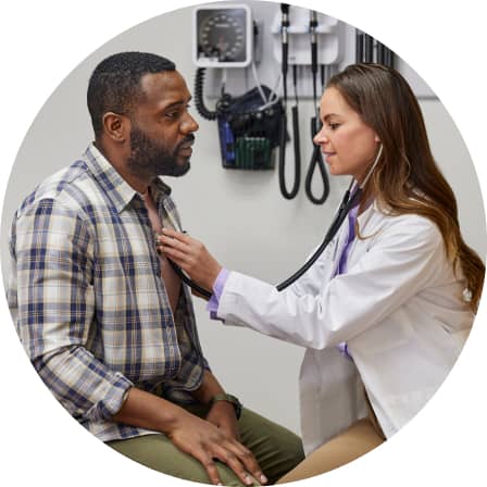 A CVS practitioner listening to a patient’s heart.