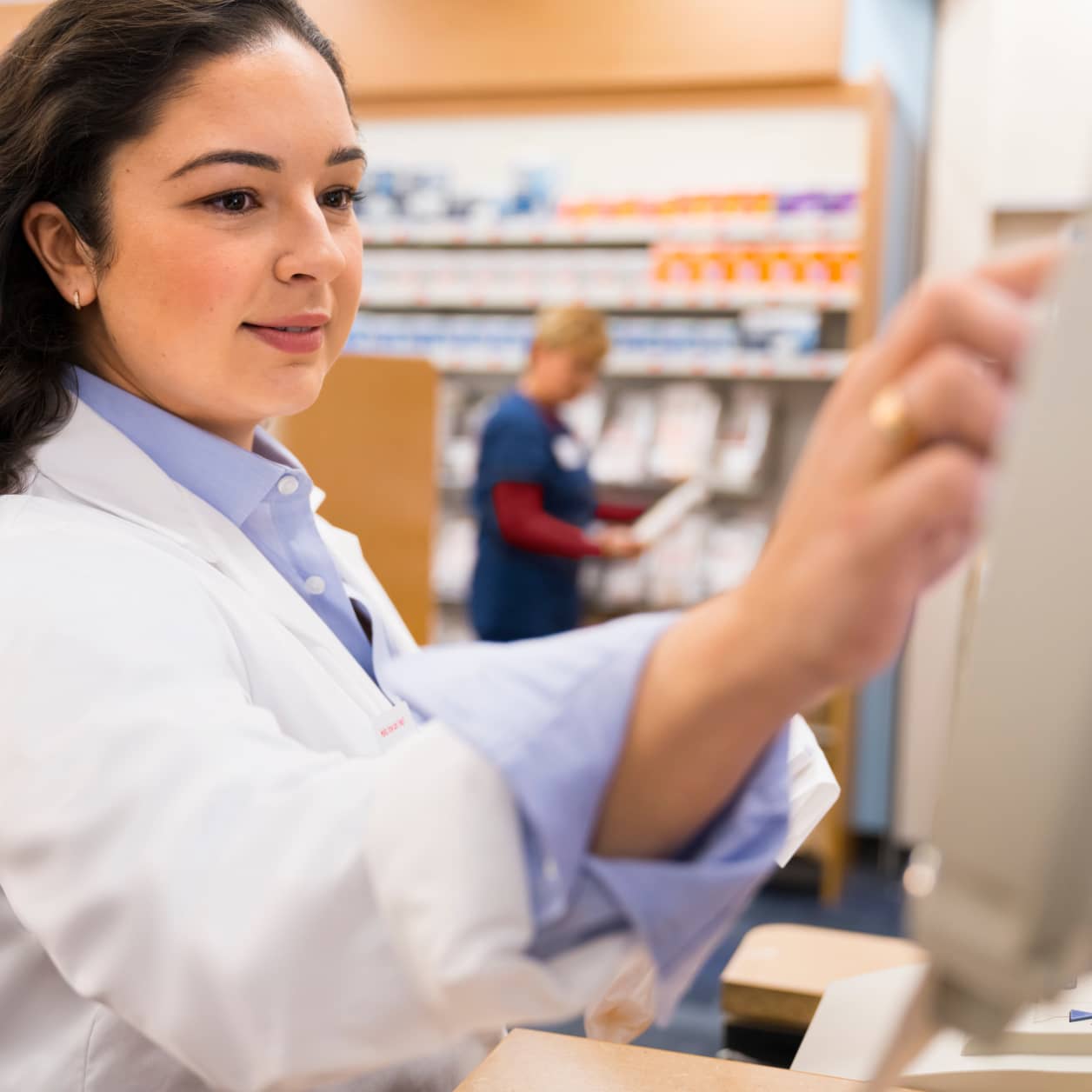 A CVS pharmacy technician at work in the pharmacy.