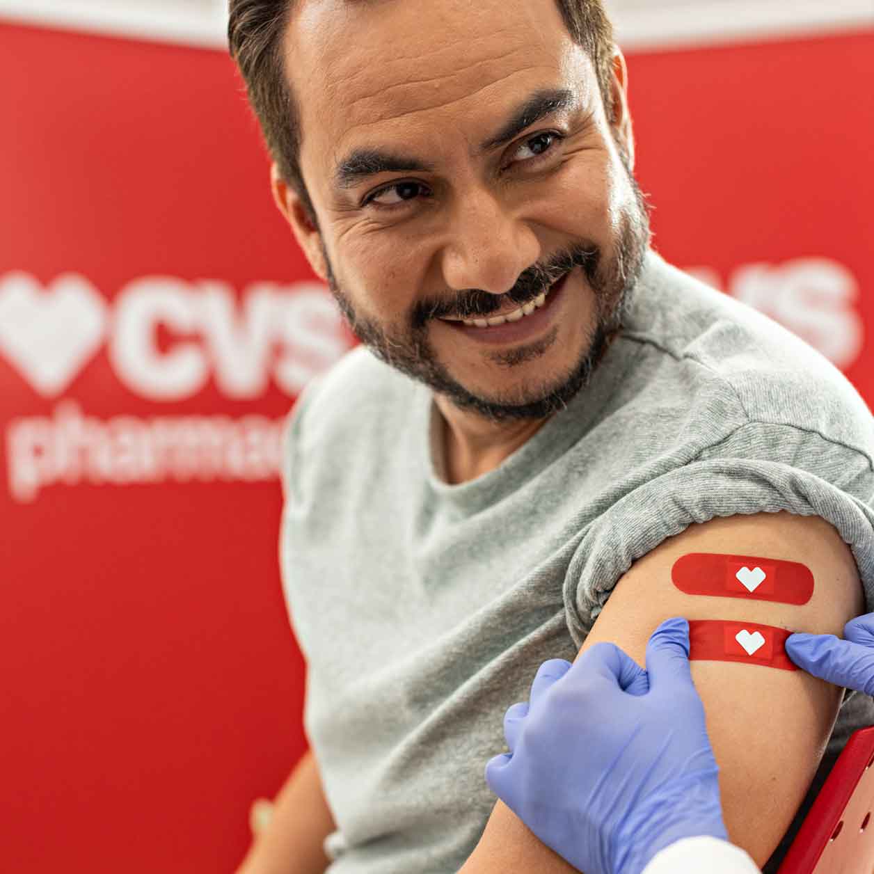 Man smiles after getting a vaccine.